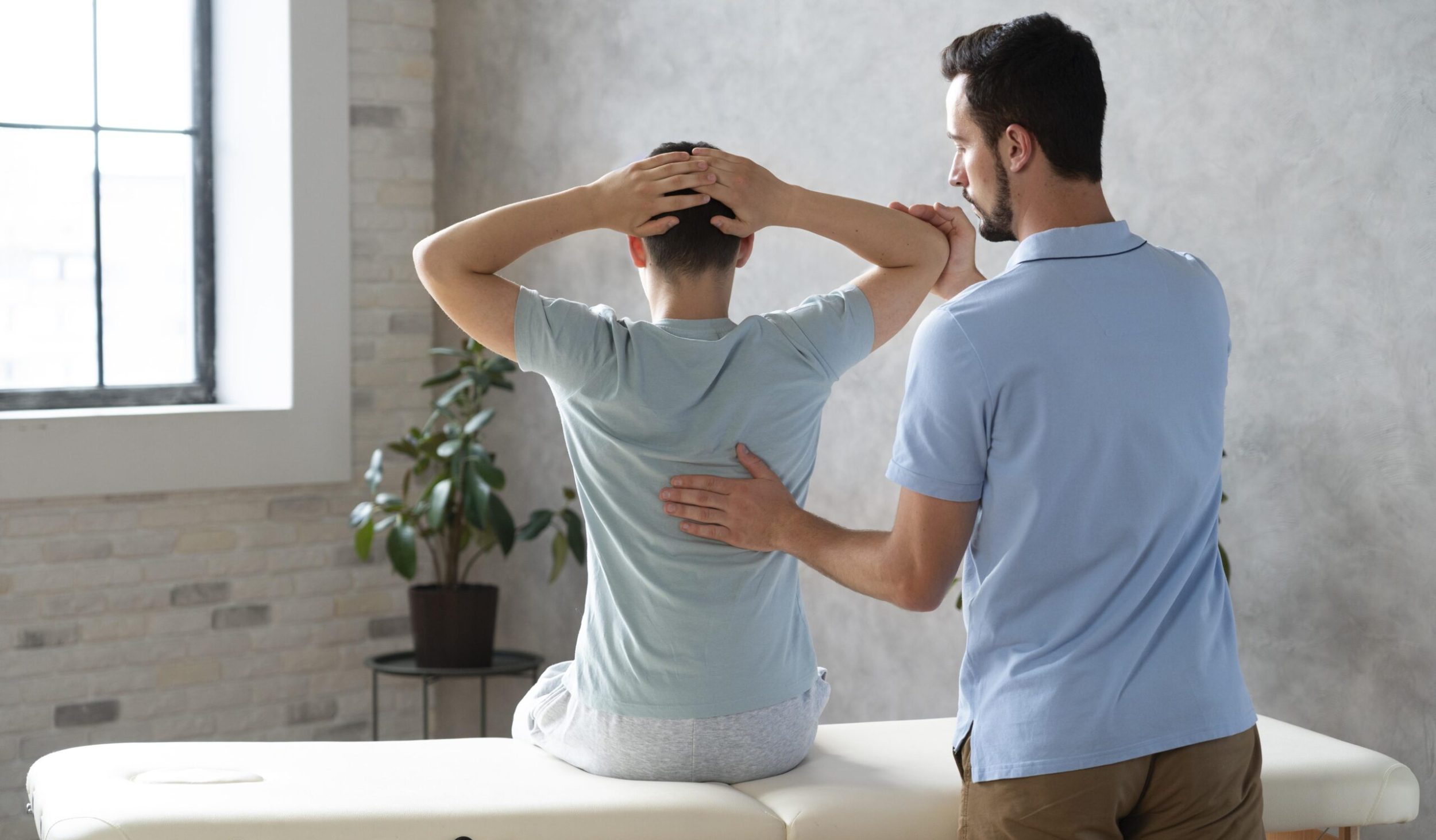 medium-shot-man-helping-patient-physiotherapy