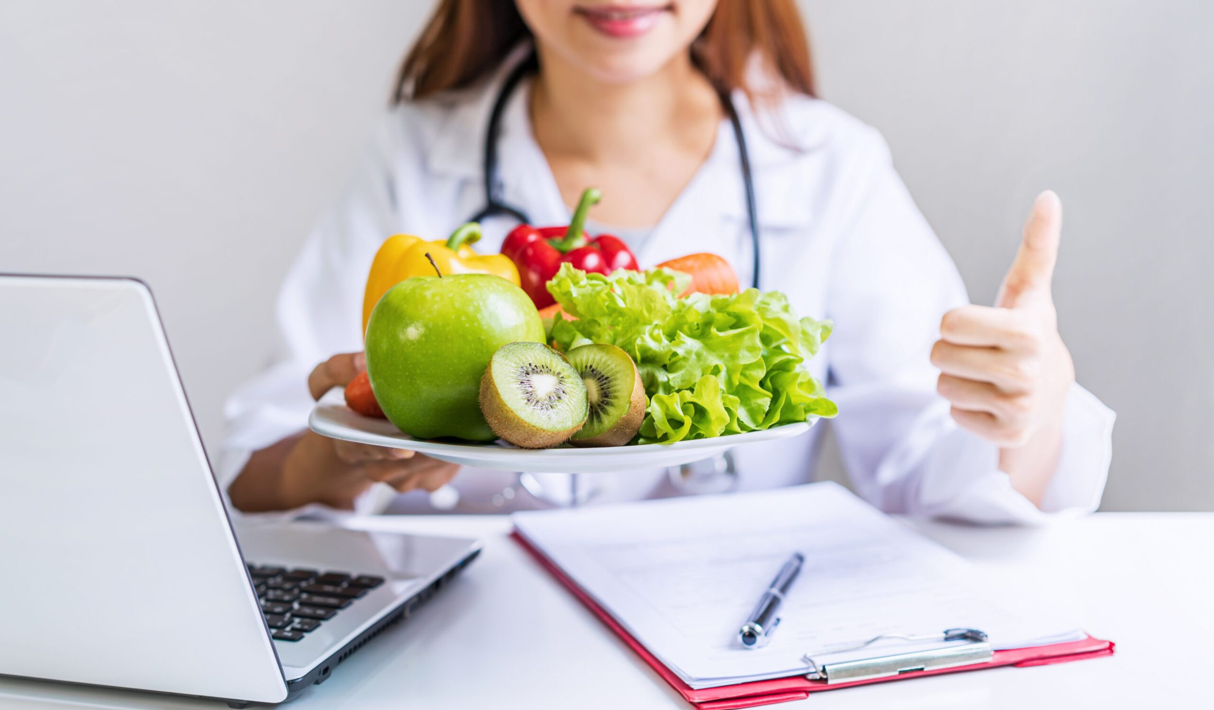 Nutritionist giving consultation to patient with healthy fruit and vegetable, Right nutrition and diet concept